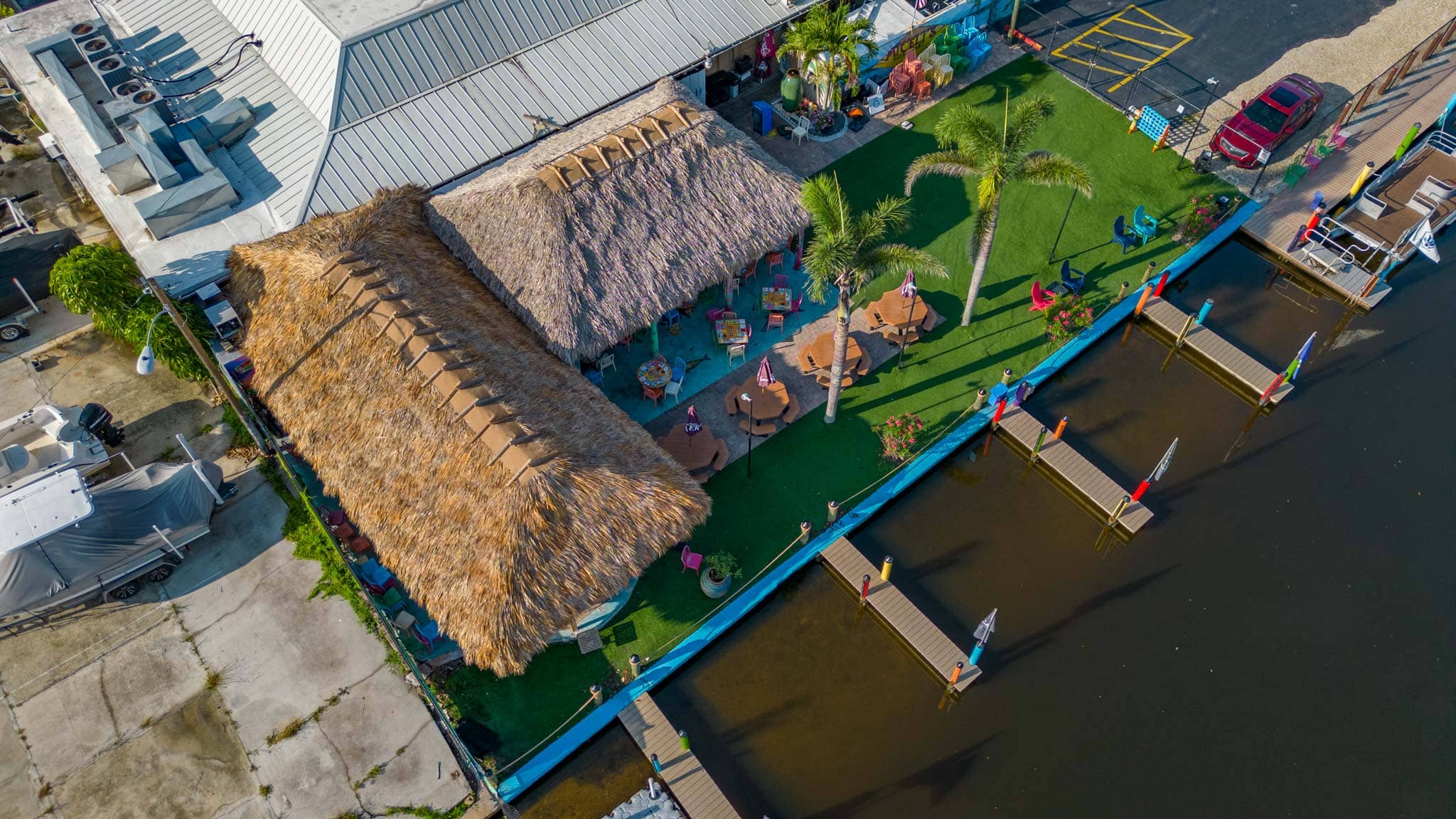 Tiki huts built over seating outside micelis restaurant